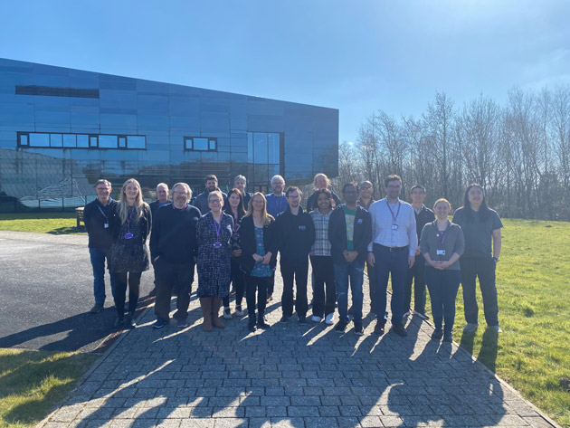 Picture shows the Dalton Cumbrian Facility building with team in the foreground