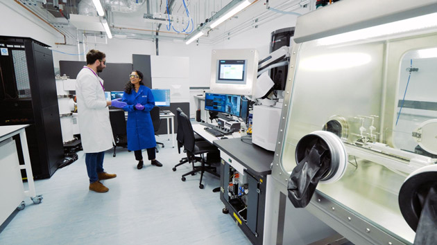 Picture shows staff in a glovebox laboratory