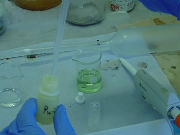Image is of a Pu experiment inside a glove box